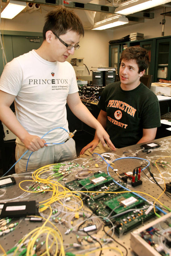 2 summer interns working on experiment