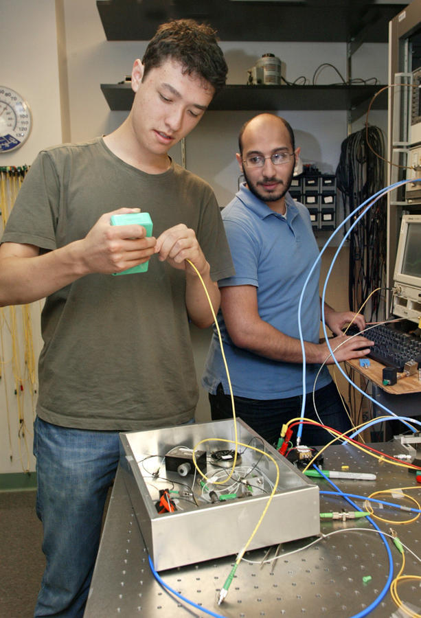 2 summer interns working on experiment